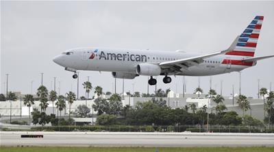 An American Airlines Boeing 737-823 lands at Miami International Airport, Monday, July 27, 2020, in Miami.American Airlines said Tuesday, Aug. 25 that it will furlough or lay off 19,000 employees in O