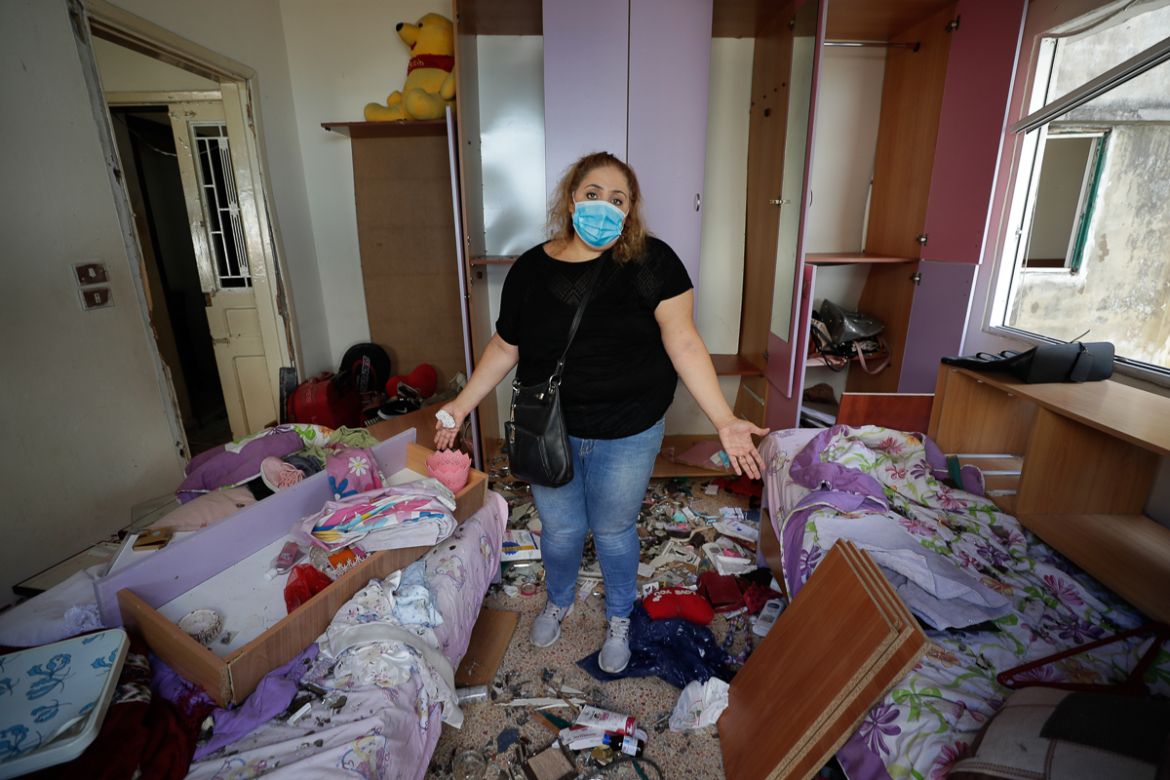 Mona Al Chami, poses for a photograph inside her destroyed apartment after Tuesday''s explosion in the seaport of Beirut, Lebanon, Thursday, Aug. 6, 2020. The gigantic explosion in Beirut on Tuesday to