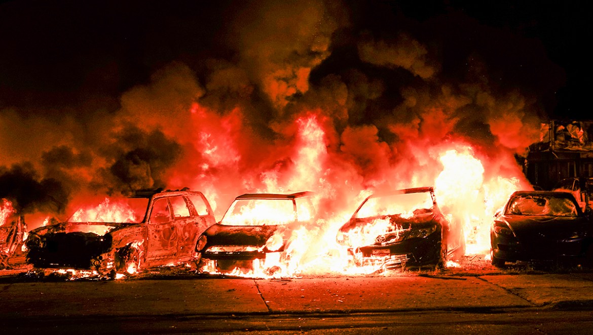 epa08623796 Automobiles burn after being set ablaze during a second night of unrest in the wake of the shooting of Jacob Blake by police officers, in Kenosha, Wisconsin, USA, 24 August 2020. According