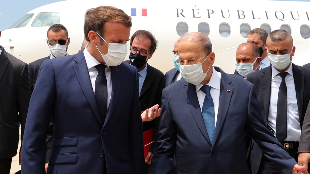 Lebanon's President Michel Aoun welcomes French President Emmanuel Macron upon his arrival at the airport in Beirut, Lebanon August 6, 2020. Dalati Nohra/Handout via REUTERS ATTENTION EDITORS - THIS I