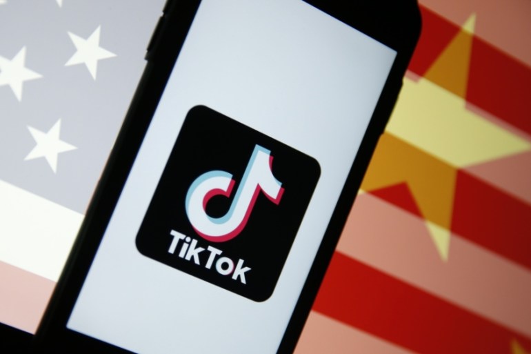 TikTok logo with Chinese, US flags [Bloomberg]