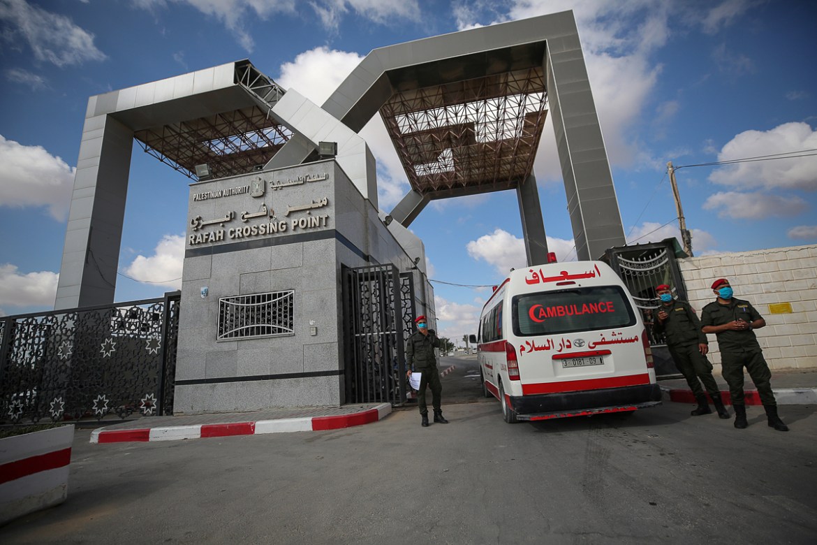 epa08597371 A Palestinian Ambulance crosses into Egypt through the Rafah border crossing between Gaza Strip and Egypt after five months of closure as a precautionary measure against the spreading of t