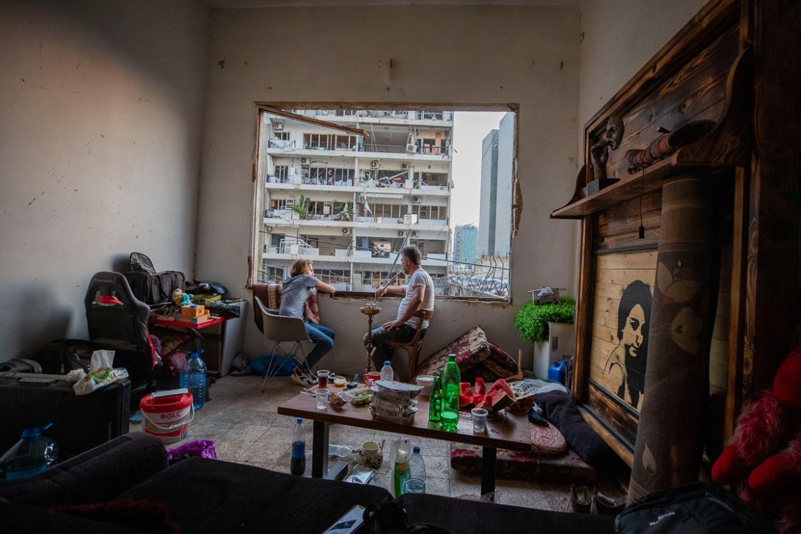 Fouad Armali smokes water-pipe in his destroyed apartment at Gemmayzeh neighborhood, which suffered extensive damage from the Tuesday''s explosion at the seaport of Beirut, Lebanon, Thursday, Aug. 6, 2