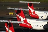 Qantas, which is cutting at least 8,500 jobs, lost about 11 billion Australian dollars ($8.5bn) in revenue to the pandemic last year alone [File: Brendon Thorne/Bloomberg]