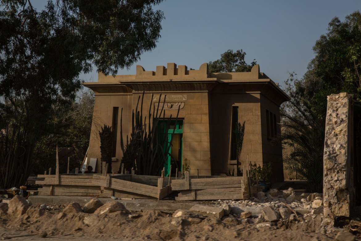 A tomb in a neo-Pharaonic style dating from the 1930s stands exposed after its walls were knocked down as part of construction of a new highway through the Northern Cemetery, part of the City of the D
