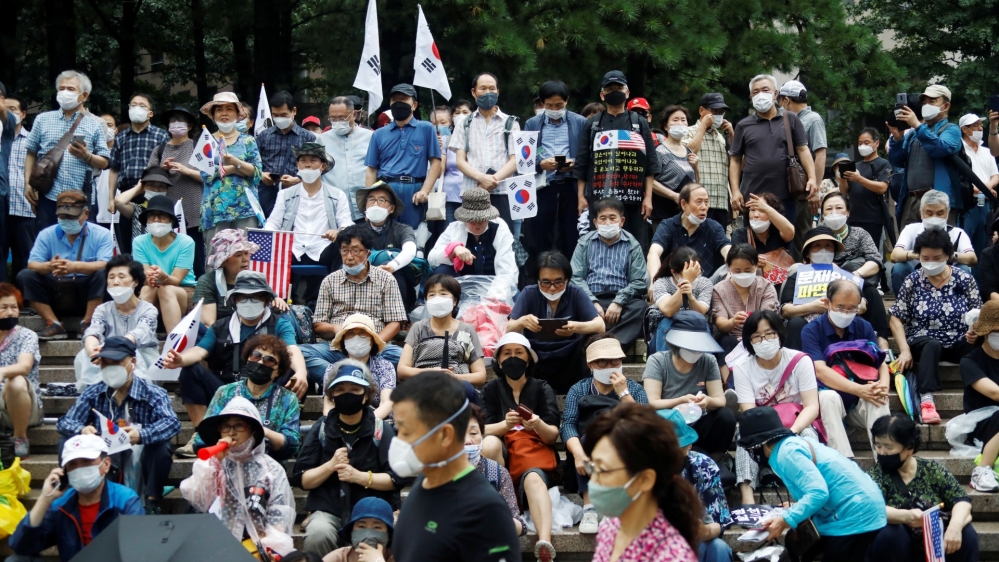 Members of conservative civic groups take part in an anti-government protest, as concerns over a fresh wave of the coronavirus disease (COVID-19) cases grow, in central Seoul
