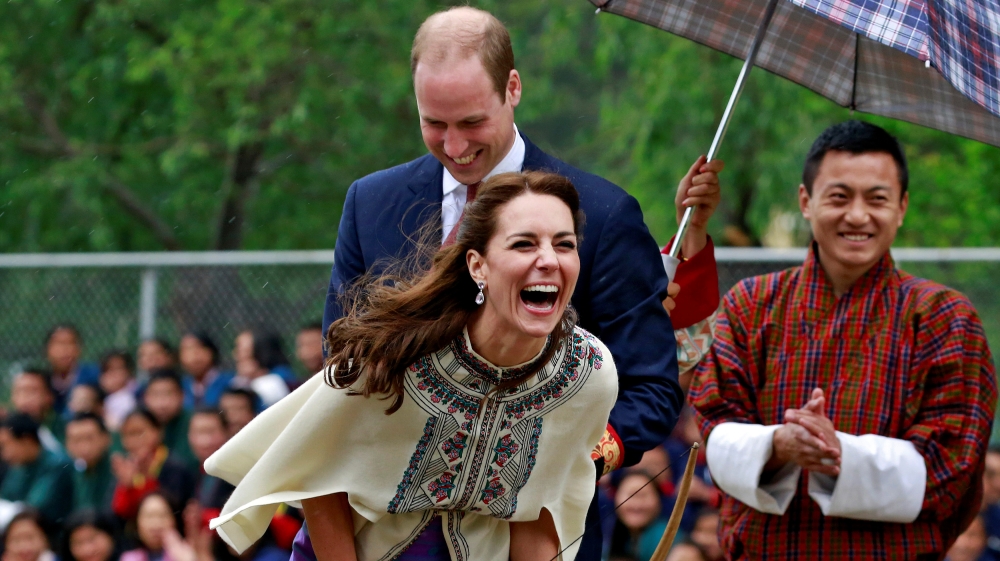 Britain's Catherine, Duchess of Cambridge reacts after shooting an arrow at Changlimithang Archery Ground in Thimphu