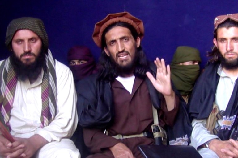 In this file image taken from a video recording, Omar Khalid Khorasani (C), a top Pakistan Taliban commander, gives an interview in Pakistan''s Mohmand tribal region on June 2, 2011. General Asim Bajwa
