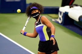 Naomi Osaka, of Japan, wears a mask in honor of Breonna Taylor as she celebrates after defeating Misaki Doi, of Japan, during the first round of the US Open tennis championships, Monday, Aug. 31, 2020