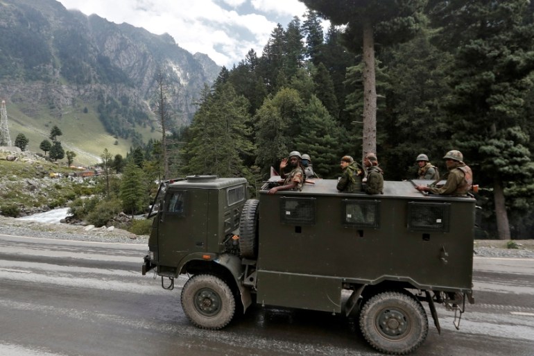 Indian army soldiers are seen atop a vehicle on a highway leading to Ladakh, at Gagangeer in Kashmir''s Ganderbal district September 2, 2020. REUTERS/Danish Ismail
