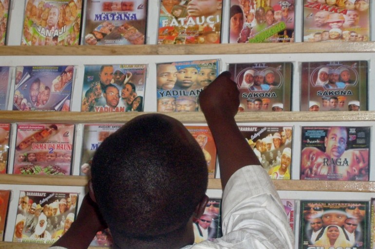 A customer searches for local Hausa films known as Kannywood which are popular among the residents of northern Nigeria''s city of Kano on February 14, 2008.Fury over a sex video in Moslem northern Nige