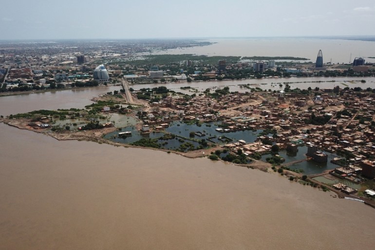 An aerial view shows buildings and roads submerged by floodwaters near the Nile river in South Khartoum, Sudan [El Tayeb Siddig/Reuters]
