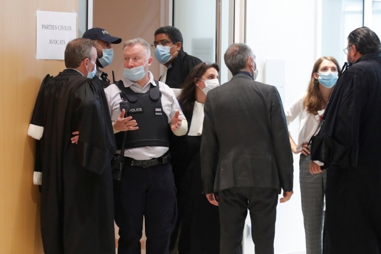 Lawyers for the victims enters the courtroom for the opening of the trial of the January 2015 Paris attacks against Charlie Hebdo satirical weekly, a policewoman in Montrouge and the Hyper Cacher kosh