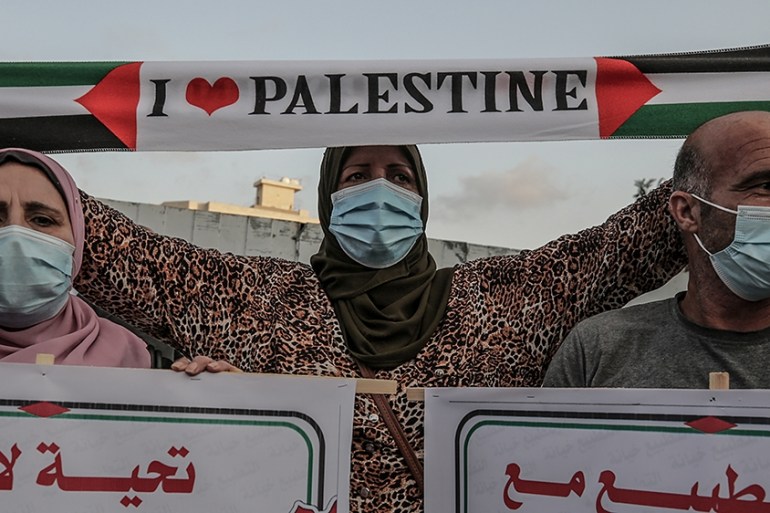 epa08671327 Palestinians attend a protest against the agreement between Israel and the United Arab Emirates and Bahrain, in Gaza city, 15 September 2020. Many are against the agreement between the UAE