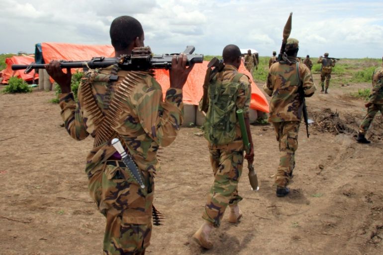 Jubbaland forces carry their ammunitions during a security patrol against Islamist al Shabaab militants in Bulagaduud town, north of Kismayu