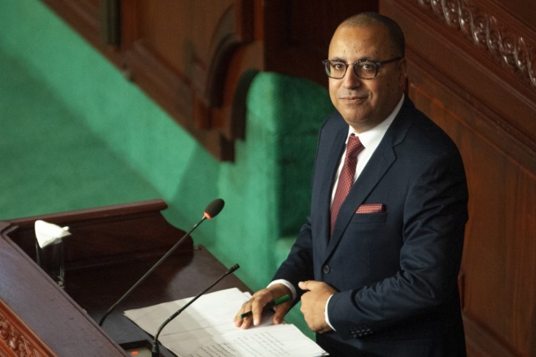 Tunisian designated Prime Minister Hichem Mechichi delivers his speech at the parliament before a confidence vote in Tunis, Tuesday, Sept. 1, 2020. (AP Photo/Riadh Dridi)