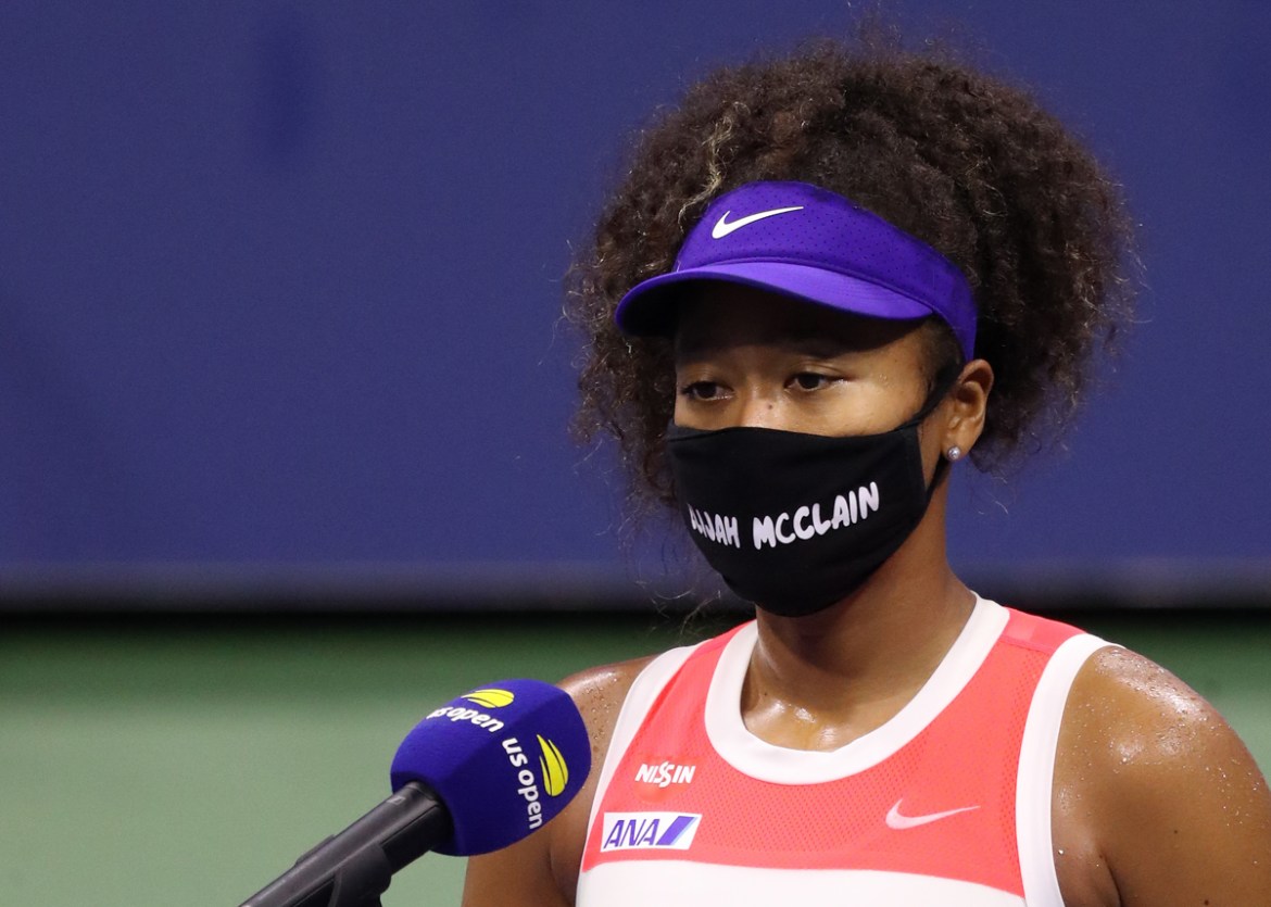 NEW YORK, NEW YORK - SEPTEMBER 02: Naomi Osaka of Japan wears a mask with the name Elijah McClain on it following her Womens Singles second round win against Camila Giorgi of Italy on Day Three of the