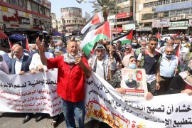 Palestinians wave Palestine flags and shout slogans during a protest against the peace agreement to establish diplomatic ties between Israel and the United Arab Emirates, in the West Bank city of Nabl