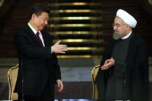 China's President Xi Jinping, left, and his Iranian counterpart Hassan Rouhani are seen together following a joint press conference in Tehran, Iran, January 23, 2016 [AP Photo/Ebrahim Noroozi]