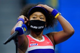Naomi Osaka, of Japan, adjusts her mask after defeating Jennifer Brady, of the United States, during a semifinal match of the US Open tennis championships, Thursday, Sept. 10, 2020, in New York. (AP P