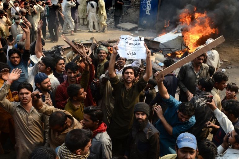 Angry Pakistani demonstrators shout slogans during a protest over alleged blasphemous remarks by a Christian in a Christian neighborhood in Badami Bagh area of Lahore on March 9, 2013. Thousands of an