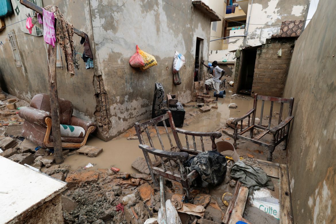 A man stands at a house''s flooded courtyard after heavy rains in the Ndiaga Mbaye district on the outskirts of Dakar, Senegal September 6, 2020.REUTERS/ Zohra Bensemra