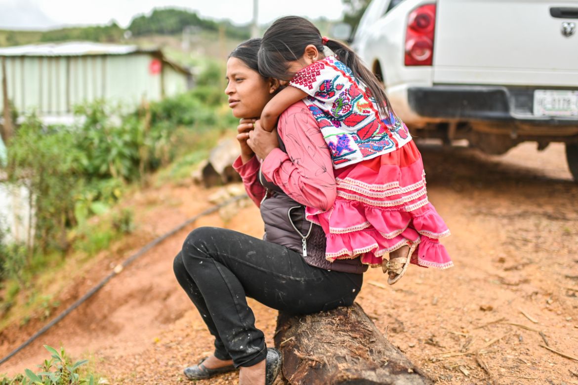 Natalia Vazquez (L) and her daughter Viridiana Rojas are photographed in San Miguel Amoltepec Viejo, Guerrero state, Mexico, on September 8, 2020, amid the COVID-19 coronavirus pandemic. - Teachers re