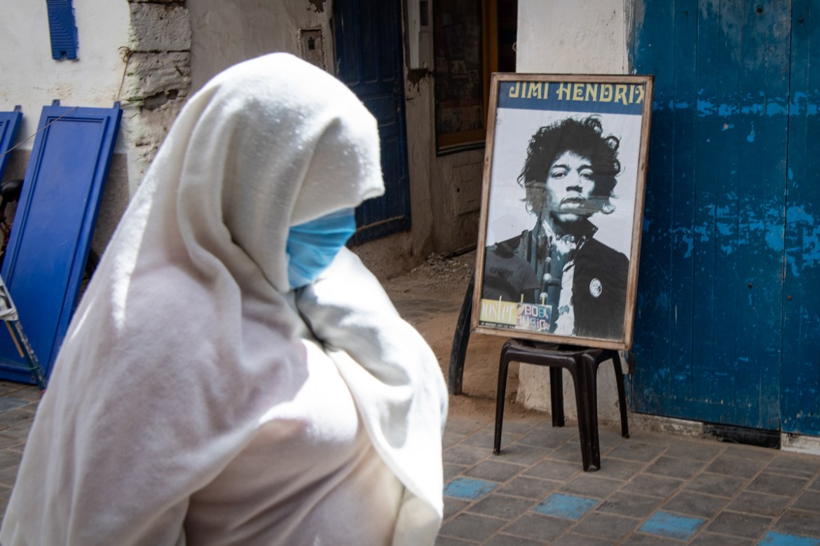 A picture taken in the Moroccan coastal city of Essaouira shows portraits of late US guitarist Jimi Hendrix on September 10, 2020. - Some claim to have seen him, others to have spoken with him -- 50 y