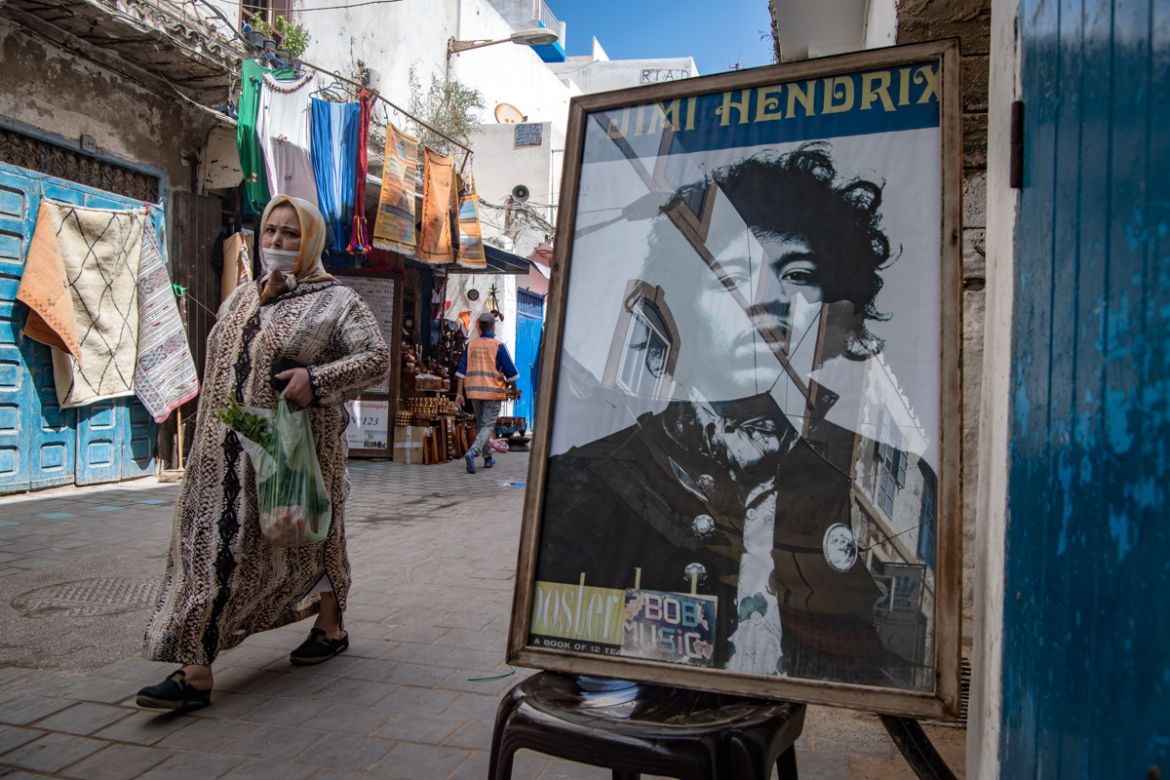A picture taken in the Moroccan coastal city of Essaouira shows portraits of late US guitarist Jimi Hendrix on September 10, 2020. - Some claim to have seen him, others to have spoken with him -- 50 y