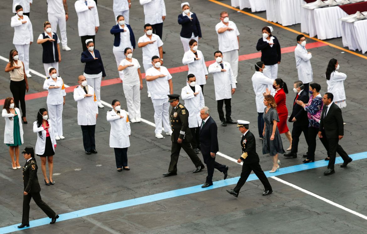 Mexico''s President Andres Manuel Lopez Obrador and his wife Beatriz Gutierrez Muller, flanked by Secretary of Defense Luis Sandoval and Secretary of the Navy Admiral Rafael Ojeda Duran, attend a milit