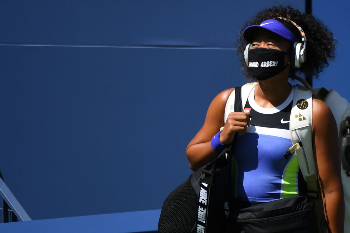 Sep 4, 2020; Flushing Meadows, New York, USA; Naomi Osaka of Japan walks onto the court wearing a mask with the name of Ahmaud Arbery prior to her match against Marta Kostyuk of Ukraine (not pictured)