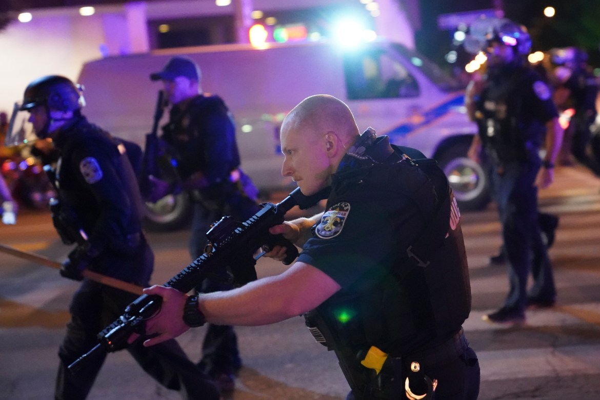 Two police officers were shot and wounded in rallies after the decision was announced. One suspect was arrested, according to the Louisville police chief [John Minchillo/AP Photo]