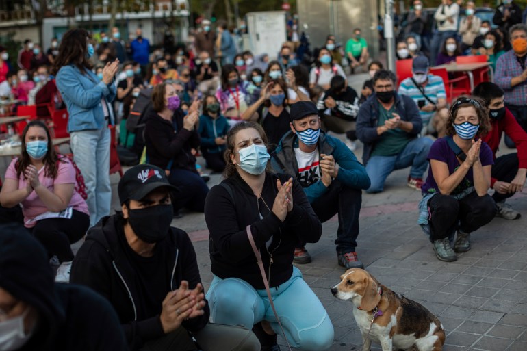 Residents of restricted mobility areas in Madrid due to the coronavirus outbreak gather during a protest to demand more resources for public health system and against social inequality in the southern neighbourhood of Vallecas, Madrid, Spain, Thursday, Sept. 24, 2020.