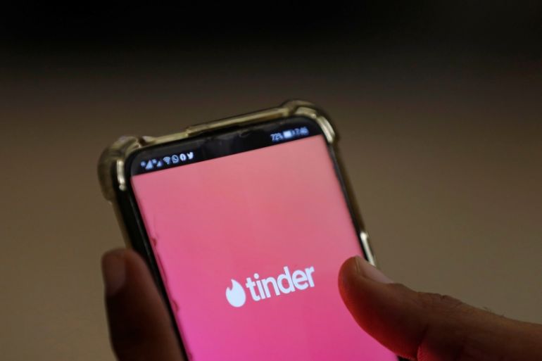 The dating app Tinder is shown on a mobile phone in this picture illustration