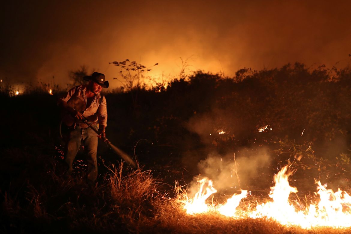Sebastiao Baldi Silva Junior, 40, who works on a farm, attempts to put out a fire on a ranch in the Pantanal, the world''s largest wetland, in Pocone, Mato Grosso state, Brazil, August 26, 2020. REUTER