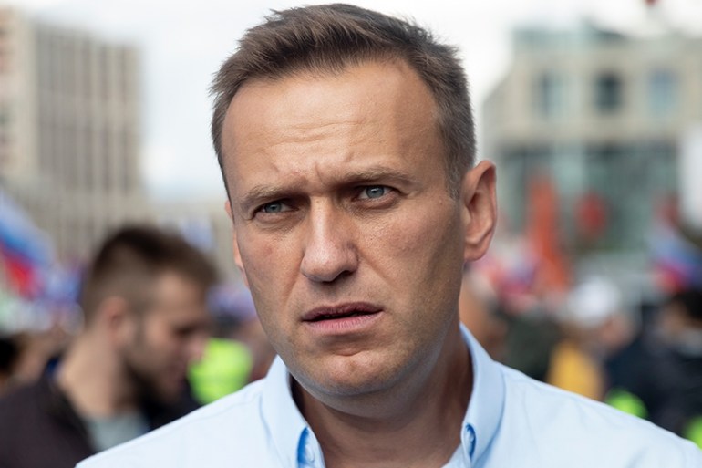 Russian opposition activist Alexei Navalny attends a protest in Moscow, Russia, Saturday, July 20, 2019. Masses of people gathered in central Moscow to demand that opposition candidates be included on