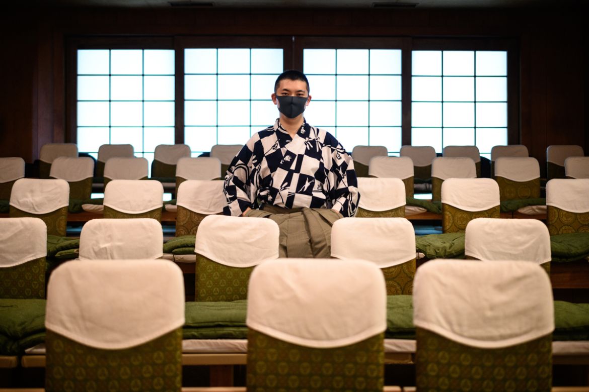 This photo taken on July 29, 2020 shows performer Kennosuke Nakamori posing for a photo after an interview with AFP at the Kamakura Noh Theatre in the town of Kamakura in Kanagawa Prefecture, about on