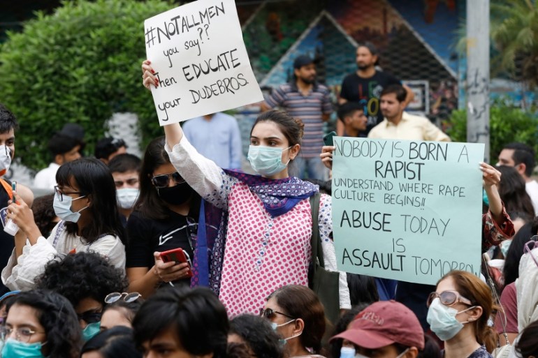 People carry signs against a gang rape that occurred along a highway and to condemn violence against women and girls, during a protest in Karachi, Pakistan September 12, 2020. REUTERS/Akhtar Soomro