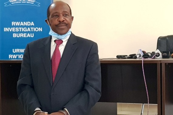 FILE PHOTO: Rusesabagina is detained and paraded in front of media in handcuffs in Kigali