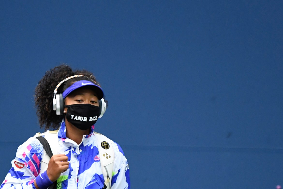 Sep 12 2020; Flushing Meadows, New York, USA; Naomi Osaka of Japan walks onto the court wearing a mask with the name of Tamir Rice prior to her match against Victoria Azarenka of Belarus (not pictured