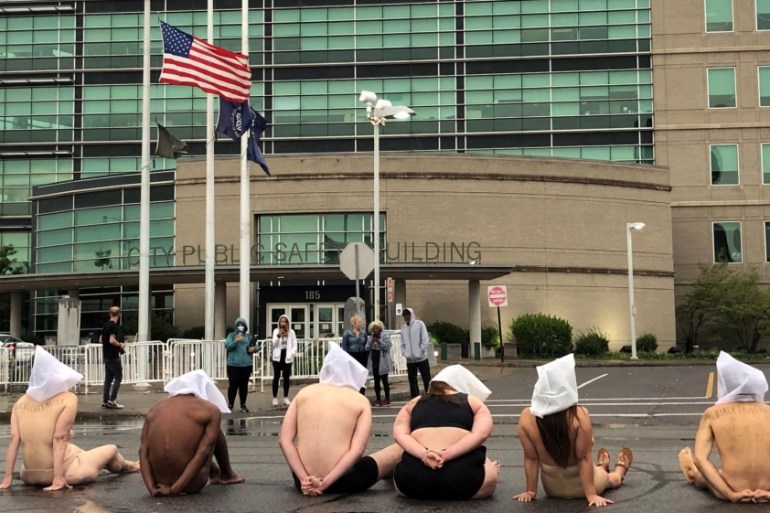 Naked protesters stage a demonstration to protest the death of Daniel Prude in Rochester