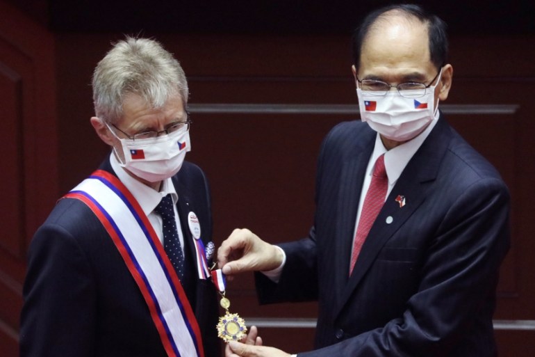 Czech senate president Milos Vystrcil receives a medal before delivering a speech at the main chamber of the Legislative Yuan in Taipei