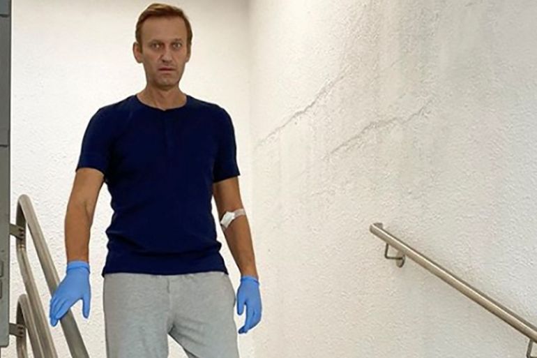 Russian opposition politician Alexei Navalny goes downstairs at Charite hospital in Berlin