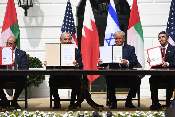 (L-R)Bahrain Foreign Minister Abdullatif al-Zayani, Israeli Prime Minister Benjamin Netanyahu, US President Donald Trump, and UAE Foreign Minister Abdullah bin Zayed Al-Nahyan hold up documents as the