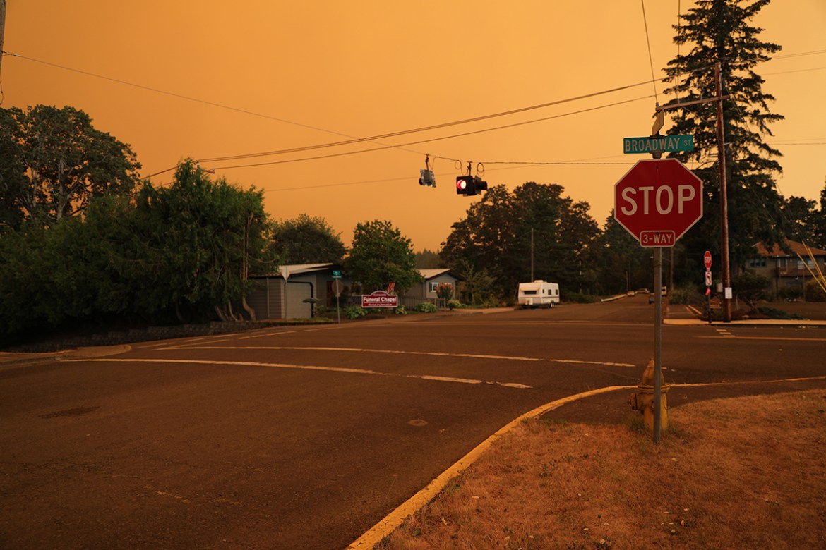 An orange smoke-filled sky is seen above Estacada, Oregon, on September 9, 2020, as fires burn nearby. - Hundreds of homes including entire communities were razed by wildfires in the western United St