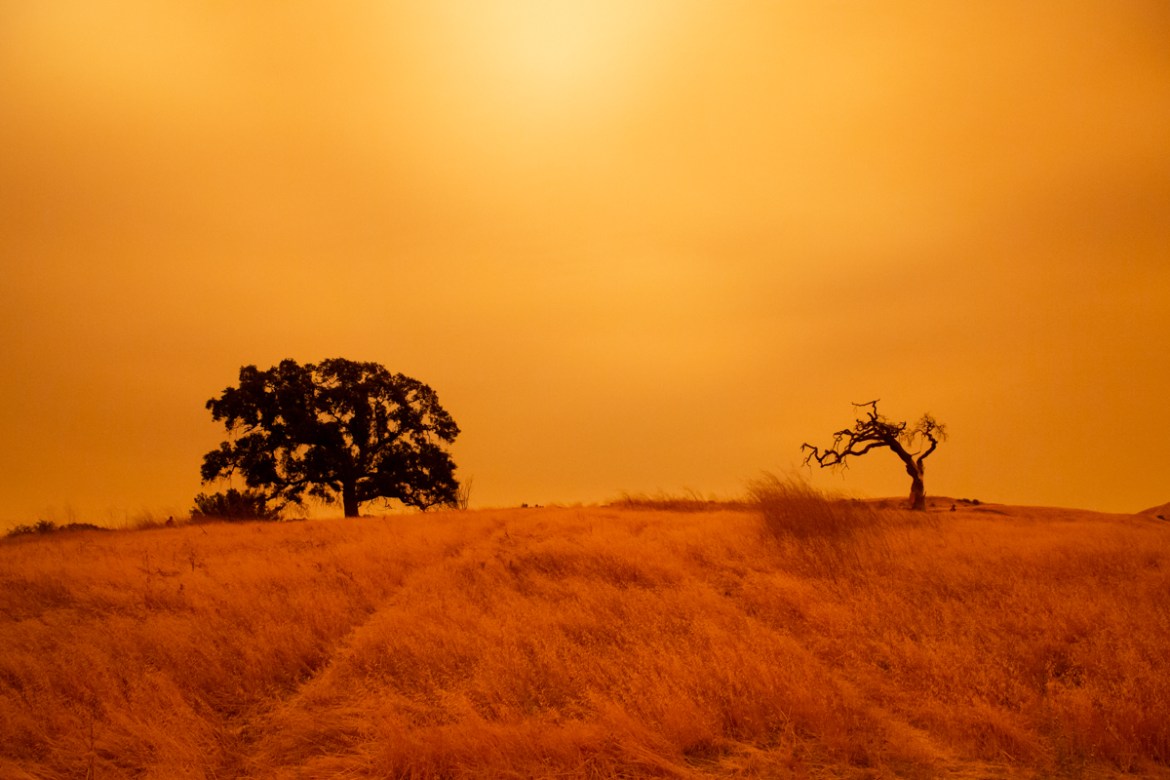 An orange sky filled with wildfire smoke hangs above hiking trails at the Limeridge Open Space in Concord, California, on September 9, 2020. - Dangerous dry winds whipped up California''s record-breaki
