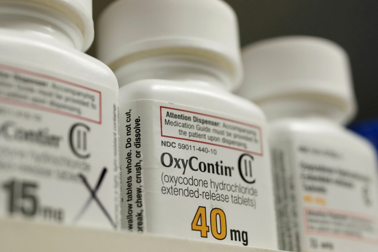 In a far-reaching agreement unveiled on Wednesday, Purdue formally admitted to criminal conduct related to the distribution of its painkillers including OxyContin [File: George Frey/Reuters]