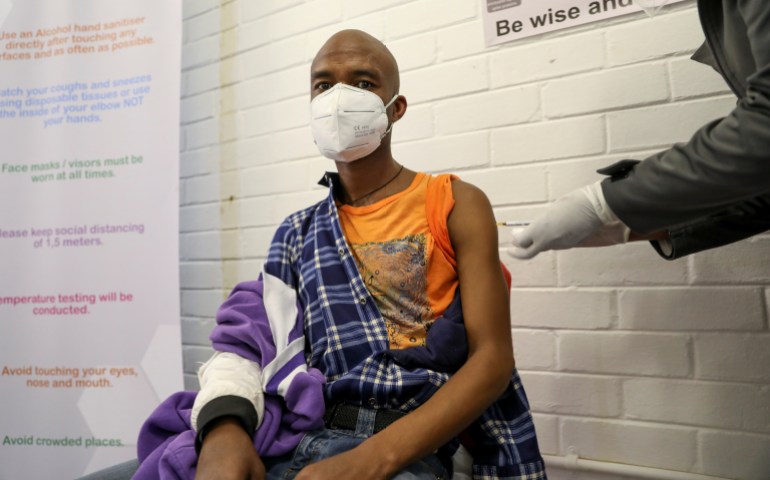 A volunteer receives an injection during a human clinical trial for a potential COVID-19 vaccine, in Soweto in June [Reuters/Siphiwe Sibeko]