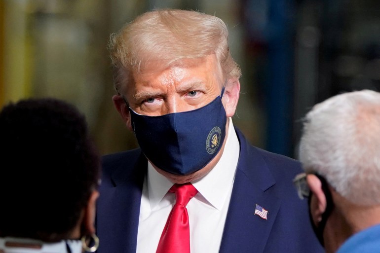 US President Donald Trump wearing face mask