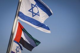 Israeli national flags fly